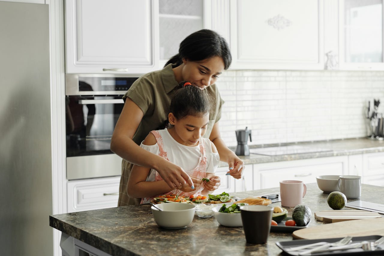 mother and daughter cook