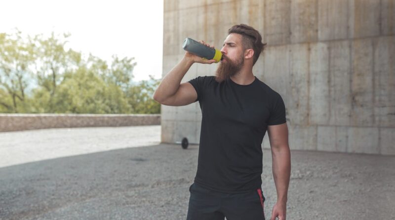 athlete resting after running stock photo