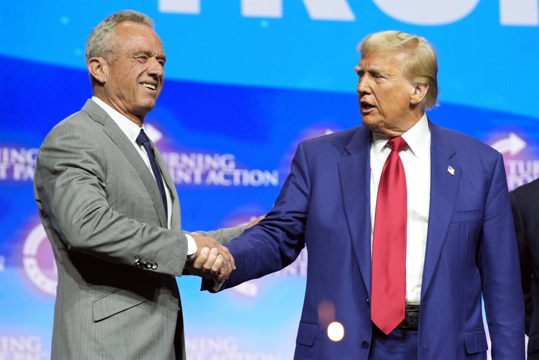 President-elect Donald Trump shakes hands with Robert F. Kennedy Jr., at a campaign rally in October. Kennedy, a vaccine skeptic, is one of Trump's health advisers.